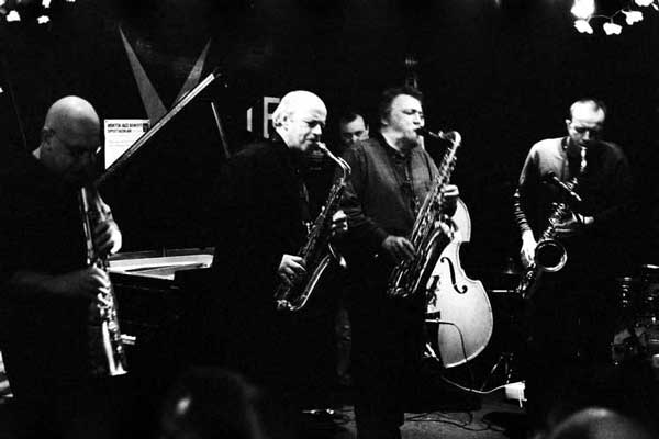 Lol Coxhill, Elton Dean, Evan Parker, Simon Picard; also John Edwards (hidden in the background with the double bass), Mark Sanders (not visible)