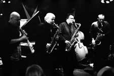 Lol Coxhill, Elton Dean, Evan Parker, Simon Picard; also John Edwards (hidden in the background with the double bass), Mark Sanders (not visible)