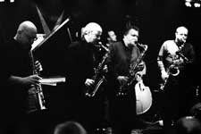 Lol Coxhill, Elton Dean, Evan Parker, Simon Picard; also John Edwards (hidden in the background with the double bass), Mark Sanders (not visible)