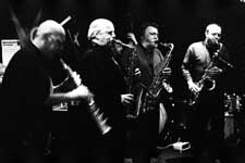 Lol Coxhill, Elton Dean, Evan Parker, Simon Picard; also John Edwards (hidden in the background with the double bass), Mark Sanders (not visible)